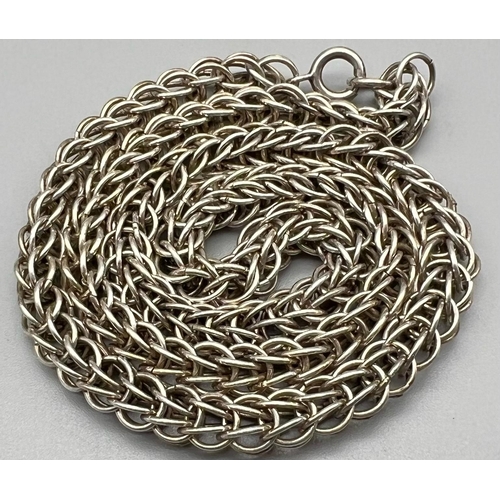 416 - A 42cms SILVER THICK INTERLOCK CHAIN.  32.6gms