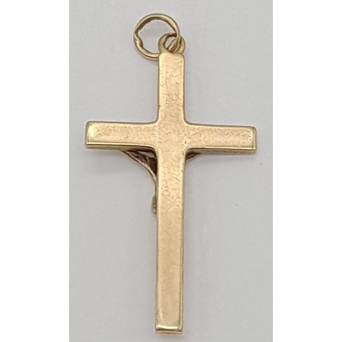 548 - A 9K yellow Gold Crucifix Pendant. 35 x 20mm. 2.76g