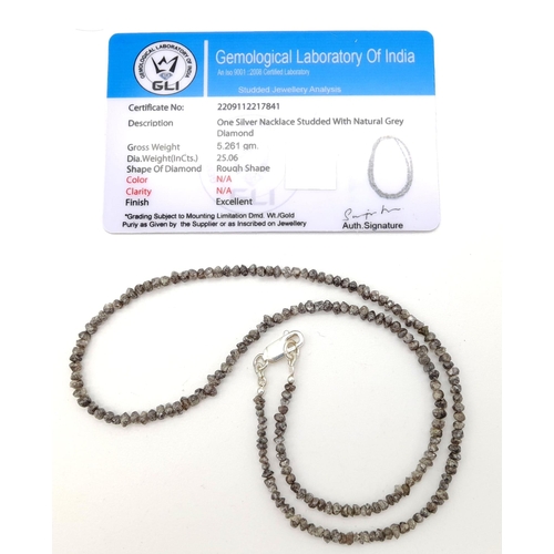 575 - A 25.06ct Raw Grey Diamond Necklace with 925 Silver clasp.
40cm. Comes with a certificate.