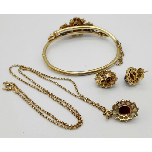 577 - A Victorian Tigers Eye and Pearl Bangle, Earring and Pendant Set. All on yellow metal. Bangle (open ... 