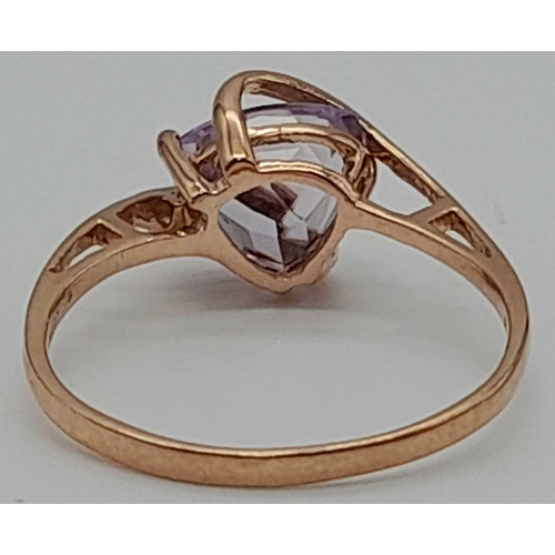 628 - A 9K Rose Gold Amethyst Fancy Ring. Size O. 1.8g total weight.