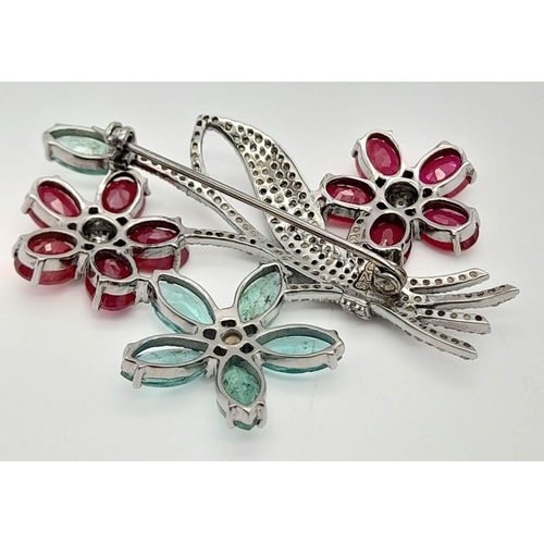 757 - An Emerald, Ruby and Diamond Floral Brooch - with gemstone weight 14.82ct , diamond weight 1.55cts. ... 