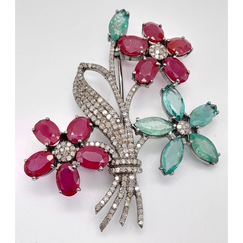 757 - An Emerald, Ruby and Diamond Floral Brooch - with gemstone weight 14.82ct , diamond weight 1.55cts. ... 