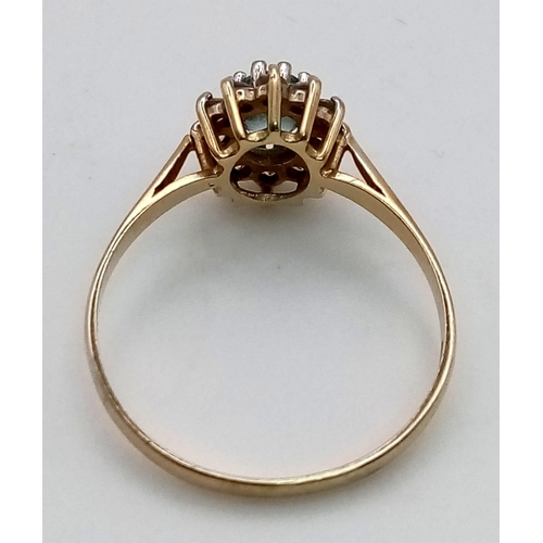 953 - A Vintage 9k Yellow Gold Topaz and White Stone Cluster Ring. Size P. 1.63g total weight.