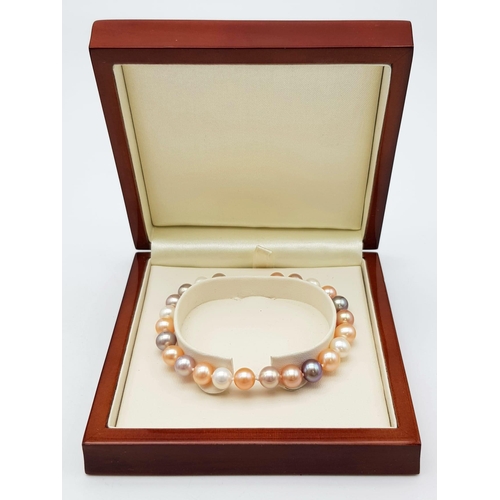 211 - A Multi-Coloured South Sea Pearl Bracelet with an 18K Gold Lobster Clasp. 16cm. 13.17g total weight.... 