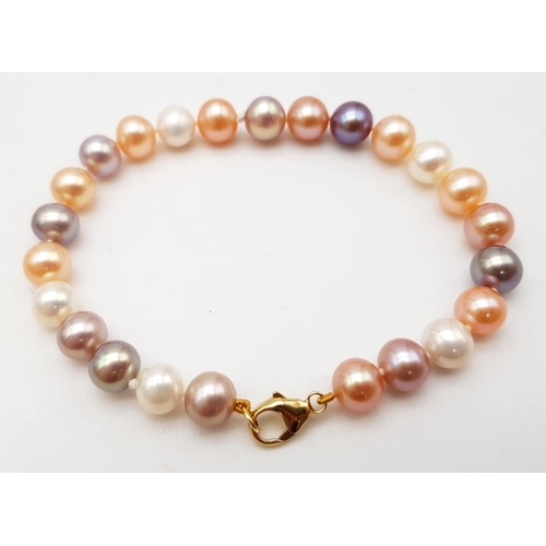 211 - A Multi-Coloured South Sea Pearl Bracelet with an 18K Gold Lobster Clasp. 16cm. 13.17g total weight.... 