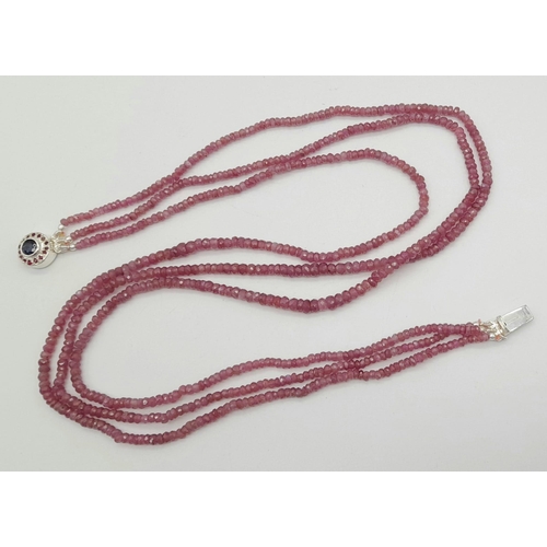 1130 - A 166ct, 3 row pink sapphire bead necklace with a sapphire and ruby clasp set in 925 silver. 40-44cm... 