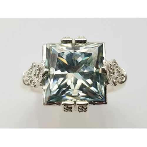 746 - A 6ct Princess Cut Ice blue moissanite Ring - with white stone accents, set in 925 silver. 6.2g tota... 