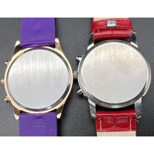 1190 - Two Geneva Watches - Purple and Red Leather straps. Both in working order.