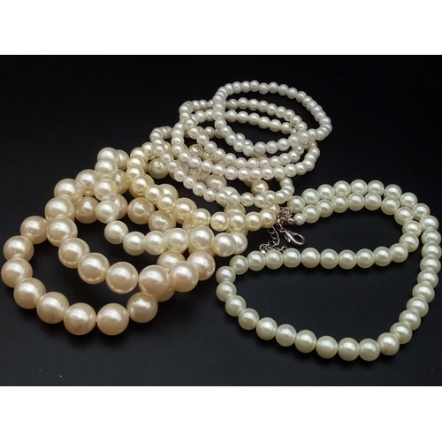 1155 - A faux pearl necklace (length: 39-48 mm) AND eight expandable faux pearl bracelets.