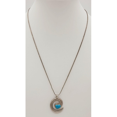 1322 - A Sterling Silver Turquoise Set Swirl Pendant on a 925 Snake Link Chain. 25mm and 40cm.