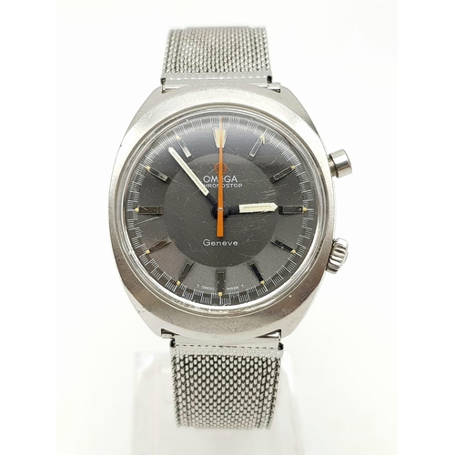 1154 - A gents OMEGA CHRONOSTOP stainless steel gents watch. Case width: 35 mm, grey face, Swiss made, mech... 