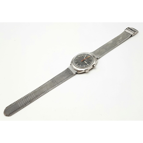 1154 - A gents OMEGA CHRONOSTOP stainless steel gents watch. Case width: 35 mm, grey face, Swiss made, mech... 