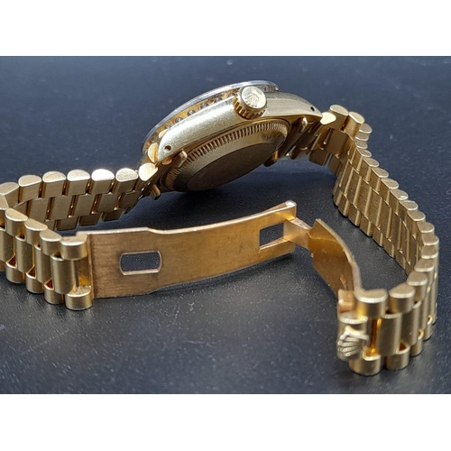 232 - An 18K Gold and Diamond Rolex Oyster Perpetual Datejust Ladies Watch. 18k gold strap and case - 26mm... 