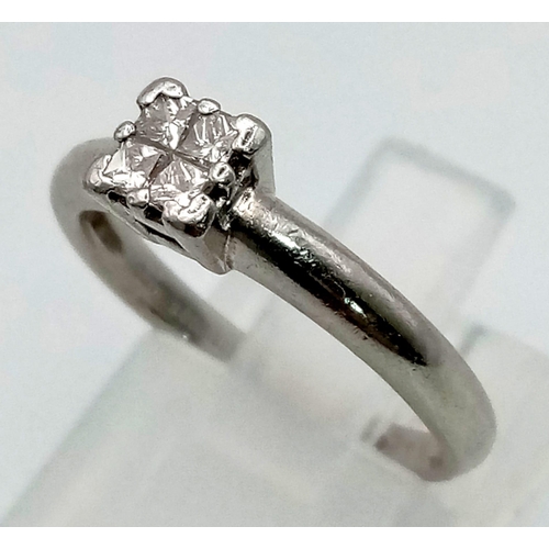 1120 - A platinum ring with four rose cut diamonds (total 0.20 carats). Ring size: K1/2, weight: 4.1 g.