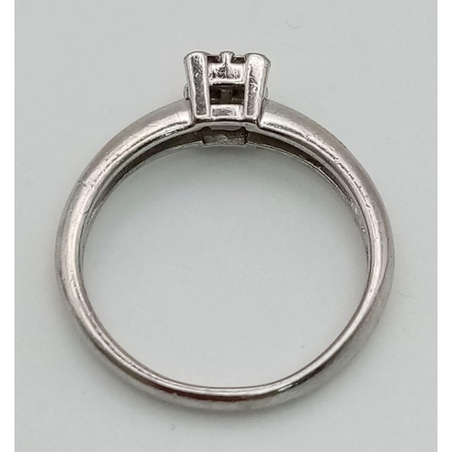 1120 - A platinum ring with four rose cut diamonds (total 0.20 carats). Ring size: K1/2, weight: 4.1 g.