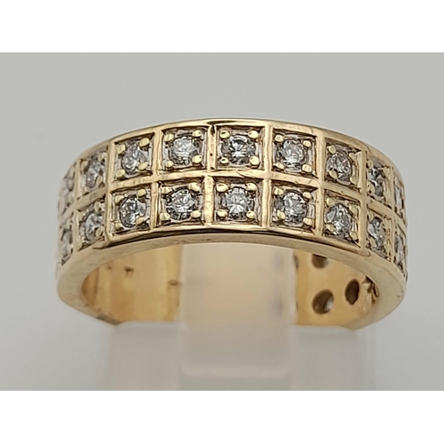 1085 - A 9 K yellow gold band ring with two diamond (0.70 carats) bands. Size: J, weight: 5.2 g.