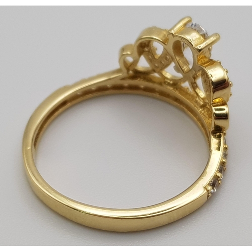 947 - A 14K YELLOW GOLD STONE SET CROWN RING .  2.8gms  size N