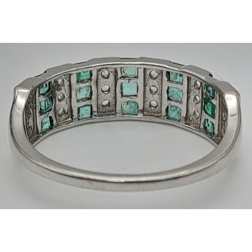 821 - 9K WHITE GOLD DIAMOND & EMERALD CHANNEL SET RING , WEIGHT 2.9G SIZE R 1/2