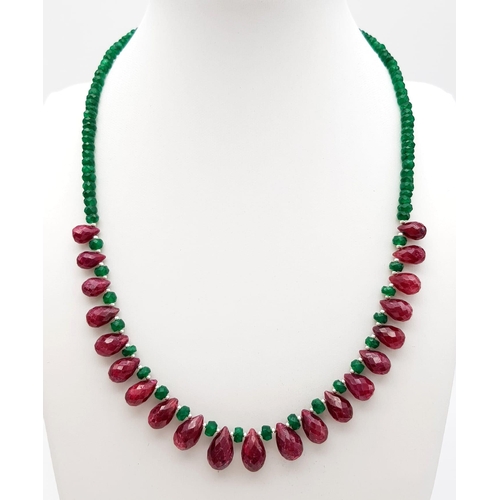 1478 - 150cts Single Strand Emerald Necklace with Ruby Drops, length 42cm, total weight 29.5 grams