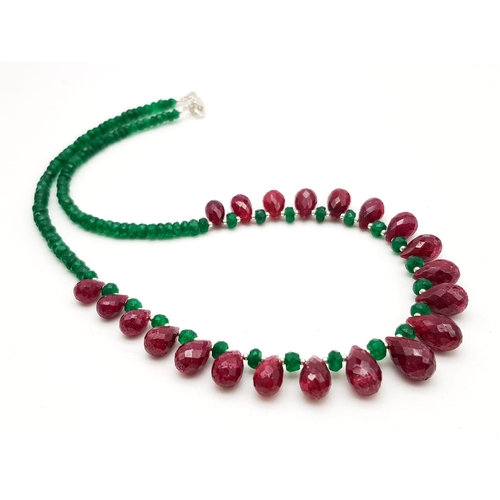 1478 - 150cts Single Strand Emerald Necklace with Ruby Drops, length 42cm, total weight 29.5 grams