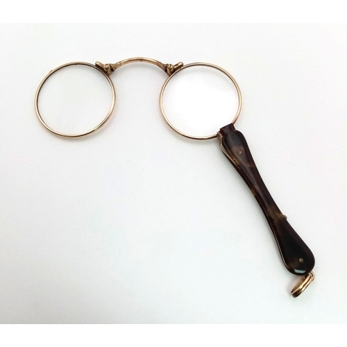 1492 - A Victorian pair of 15 carat yellow gold lorgnette spectacles made in France. They have a tortoise s... 