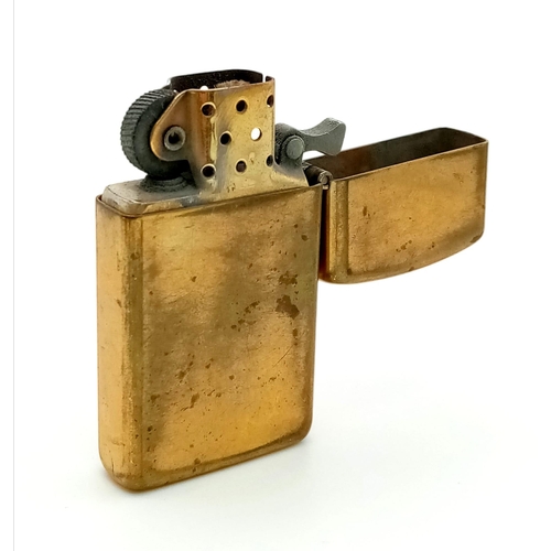 1496 - A Vintage Solid Brass Zippo Lighter. 5.5 x 3cm.