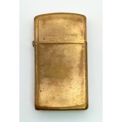 1496 - A Vintage Solid Brass Zippo Lighter. 5.5 x 3cm.