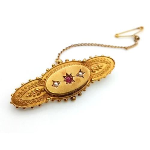 1252 - An Antique Victorian 15K Yellow Gold Seed Pearl and Ruby Brooch. Comes with a safety chain. 4.5cm. 4... 