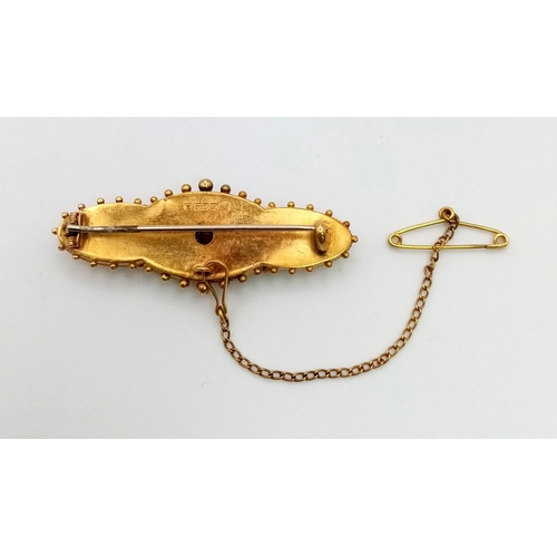 1252 - An Antique Victorian 15K Yellow Gold Seed Pearl and Ruby Brooch. Comes with a safety chain. 4.5cm. 4... 