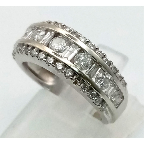 1145 - White gold round diamond ring set in a sweeping style with round diamonds in the centre. very elegan... 