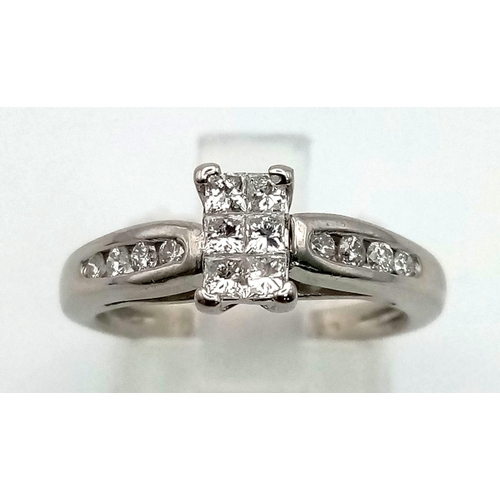 1083 - A Platinum 950 Diamond Ring. Six princess cut diamonds in centre cluster with four diamond accents o... 