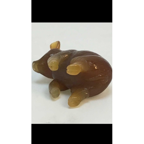 1039 - RUSSIAN 14k GOLD CARVED AGATE HARDSTONE MODEL OF A PIG,
20th century, upright, the eyes set with blu... 