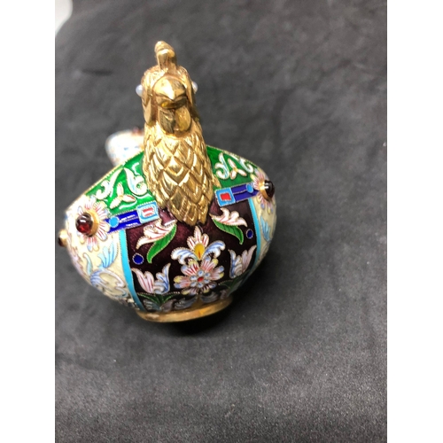 1114 - A Russian silver and enamel gem set bird kovsh 
Weight 133.2 grams 
Length 13.5cm to tail 
Width 6.8... 