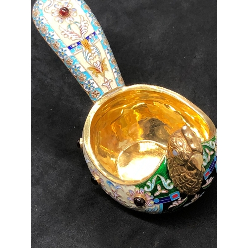 1114 - A Russian silver and enamel gem set bird kovsh 
Weight 133.2 grams 
Length 13.5cm to tail 
Width 6.8... 