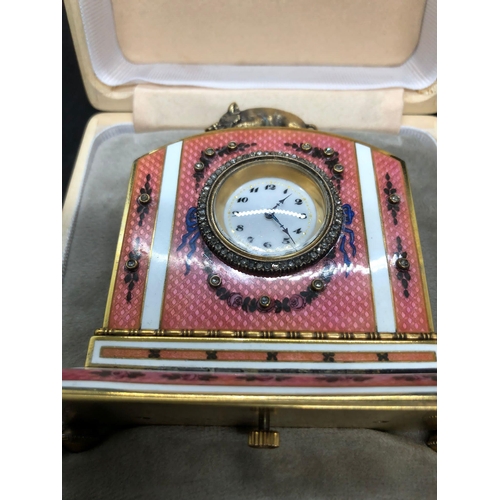 1115 - A stunning Russian silver and enamel diamond clock 

Weight 233.3 grams 
Height to hog top 9cm
Lengt... 