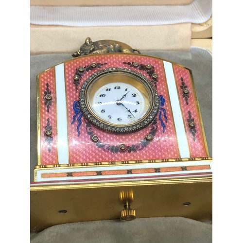 1115 - A stunning Russian silver and enamel diamond clock 

Weight 233.3 grams 
Height to hog top 9cm
Lengt... 