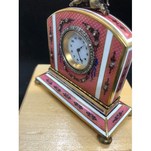 1115 - A stunning Russian silver and enamel diamond clock 

Weight 233.3 grams 
Height to hog top 9cm
Lengt... 