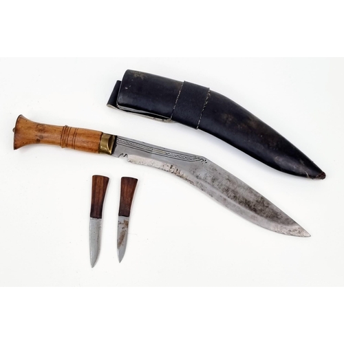 1178 - WW2 Period Kukri Engraved Blade in original sheath with both side knives. Wood and Brass Handle. 39c... 