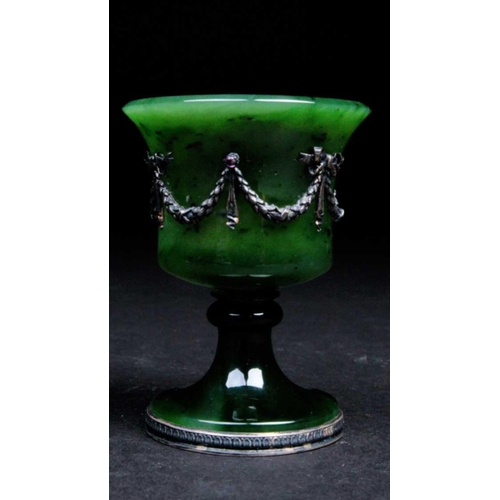 248 - A Faberge nephrite jade cup, 20th century, the bell shape bowl with applied silver swags tied with r... 