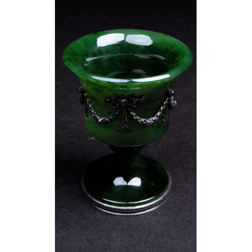 248 - A Faberge nephrite jade cup, 20th century, the bell shape bowl with applied silver swags tied with r... 