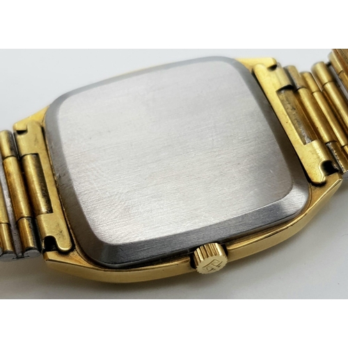 1045 - A Vintage Tissot Stylist Gents Quartz Watch. Gilded strap and case - 32mm. Gilded dial with date win... 