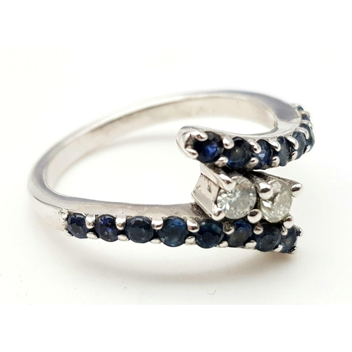 1136 - A Blue Sapphire Ring with White Moissanites (size O) and dangler sapphire earrings (4cm).  All set i... 