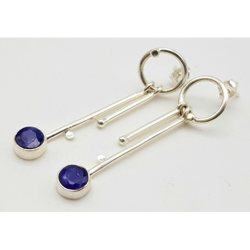 1136 - A Blue Sapphire Ring with White Moissanites (size O) and dangler sapphire earrings (4cm).  All set i... 