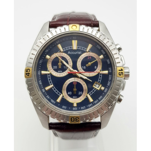 1300 - An Accurist Chronograph Gents Watch. Burgundy leather strap and case - 42mm. Black dial with three g... 