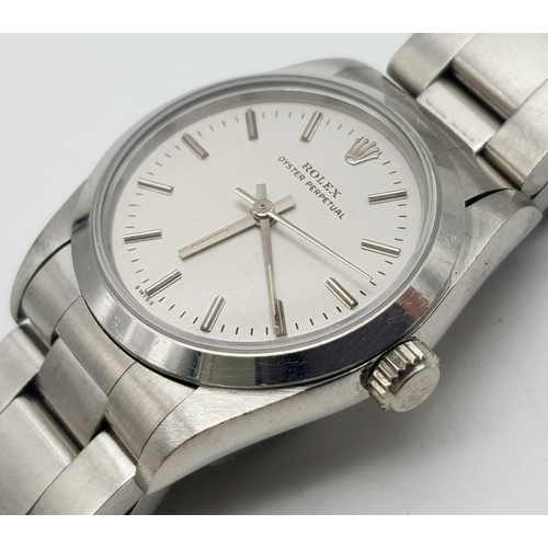 163 - A Rolex Oyster Perpetual Automatic Ladies Watch. Stainless steel strap and case - 30mm. Silver tone ... 