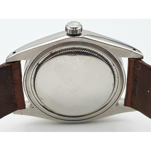 347 - A Rolex Oysterdate Precision Gents Watch. Brown leather strap. Stainless steel case - 36mm. White di... 