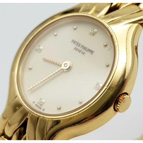 94 - A Patek Phillipe 18K Gold Ladies Quartz Watch. 18k gold strap and case - 22mm. Cream dial with diamo... 