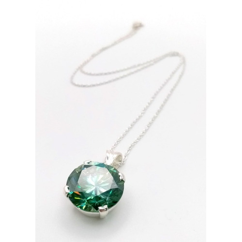 1283 - A 15ct Blue Moissanite pendant set in 925 silver with a disappearing silver necklace. 15mm and 42cm.... 