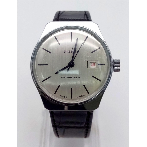 1305 - A Vintage Mihla Mechanical Gents Watch. Black leather strap. Case - 35mm. Silver-tone dial with date... 